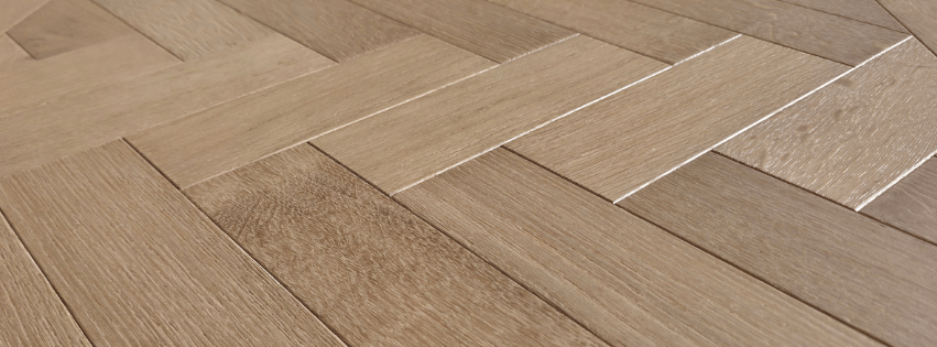 Very close up image of engineered European oak, image is of a single parquet tile. Expanded to show the grain and stain quality. 