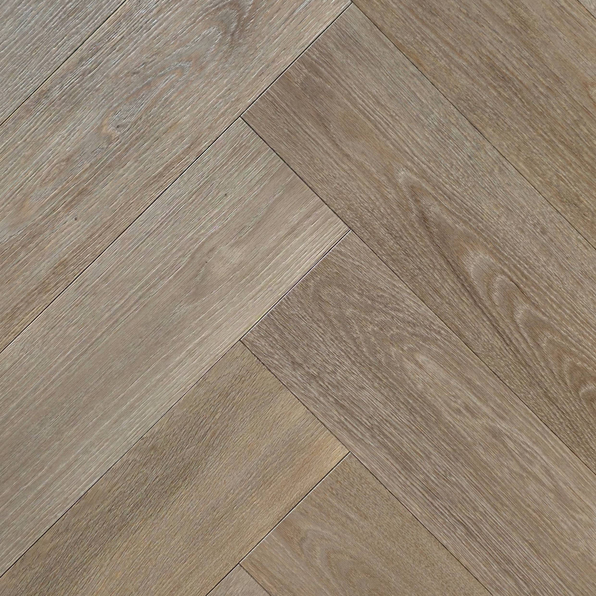Engineered European Oak Ember Valley - Herringbone, shown mounted in natural lighting, close up.