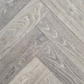 Close up of Luxe Timberline engineered european oak herringbone flooring.