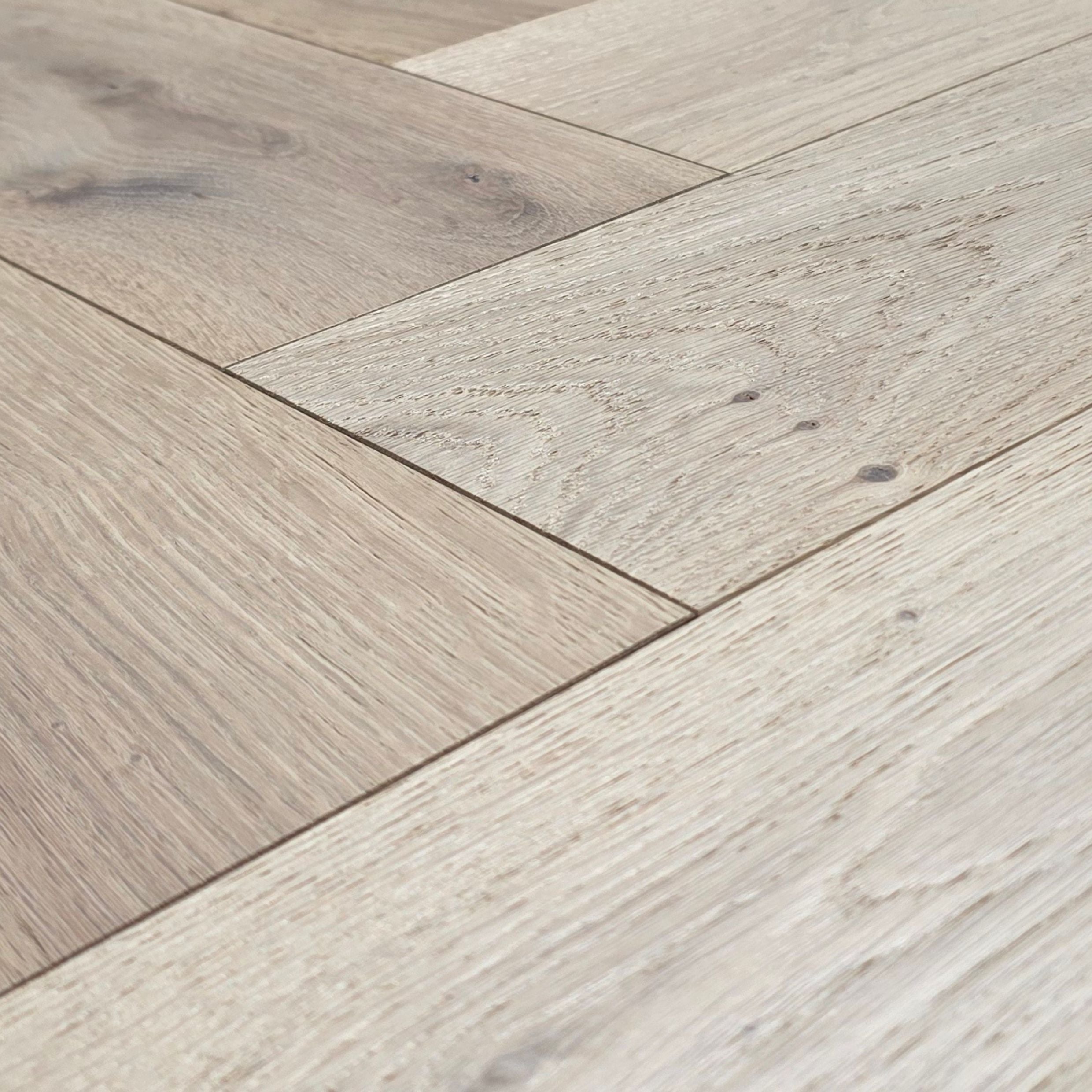 Engineered European Oak Verbier Bare - Herringbone. Close up to show grain and texture. 