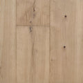 Light natural oak wood flooring planks with visible grain, knots, and subtle seams between panels. Engineered European Oak Verbier Bare wide plank  shown.