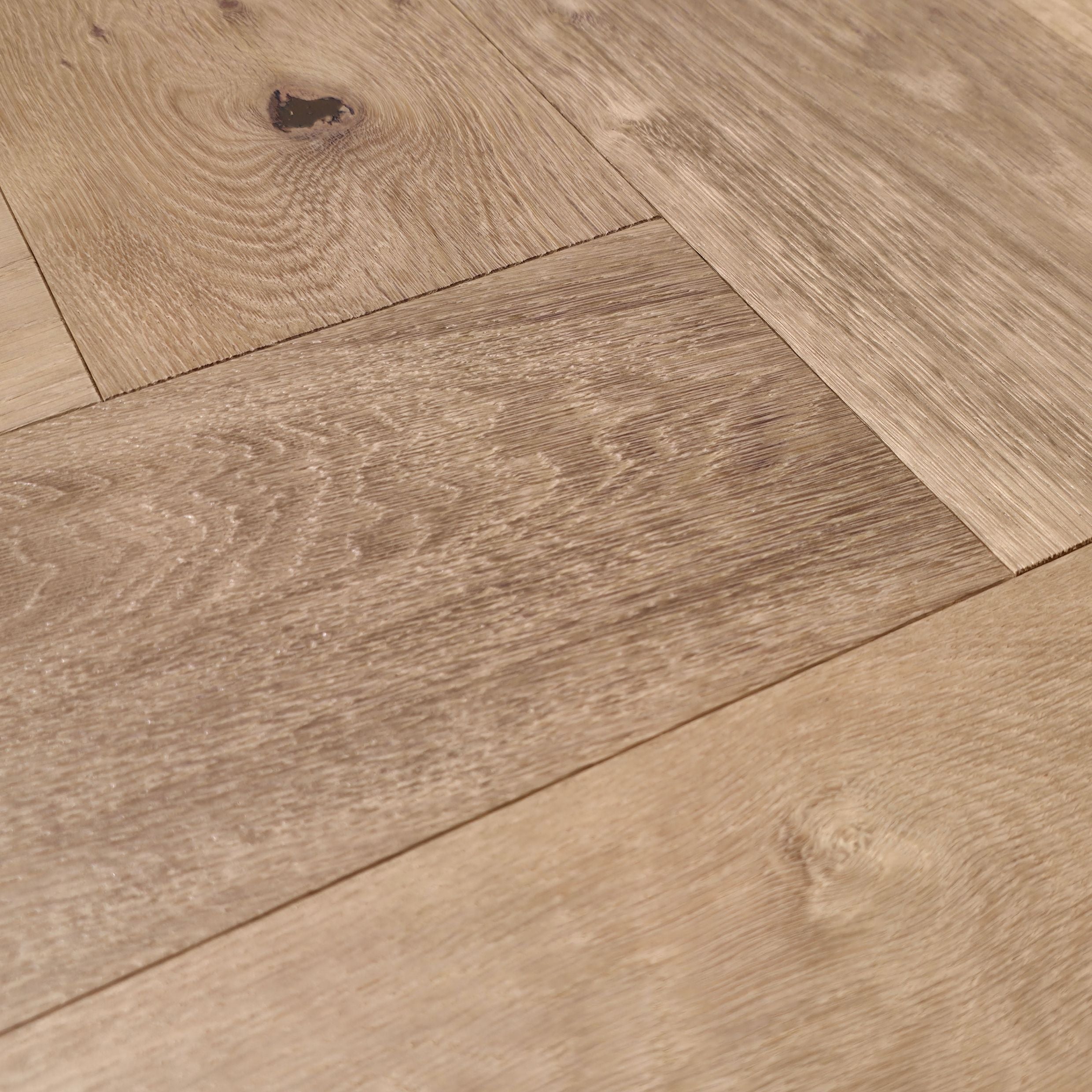 Engineered European Oak Gstaad Glow - Herringbone macro close up to show grain detail. 