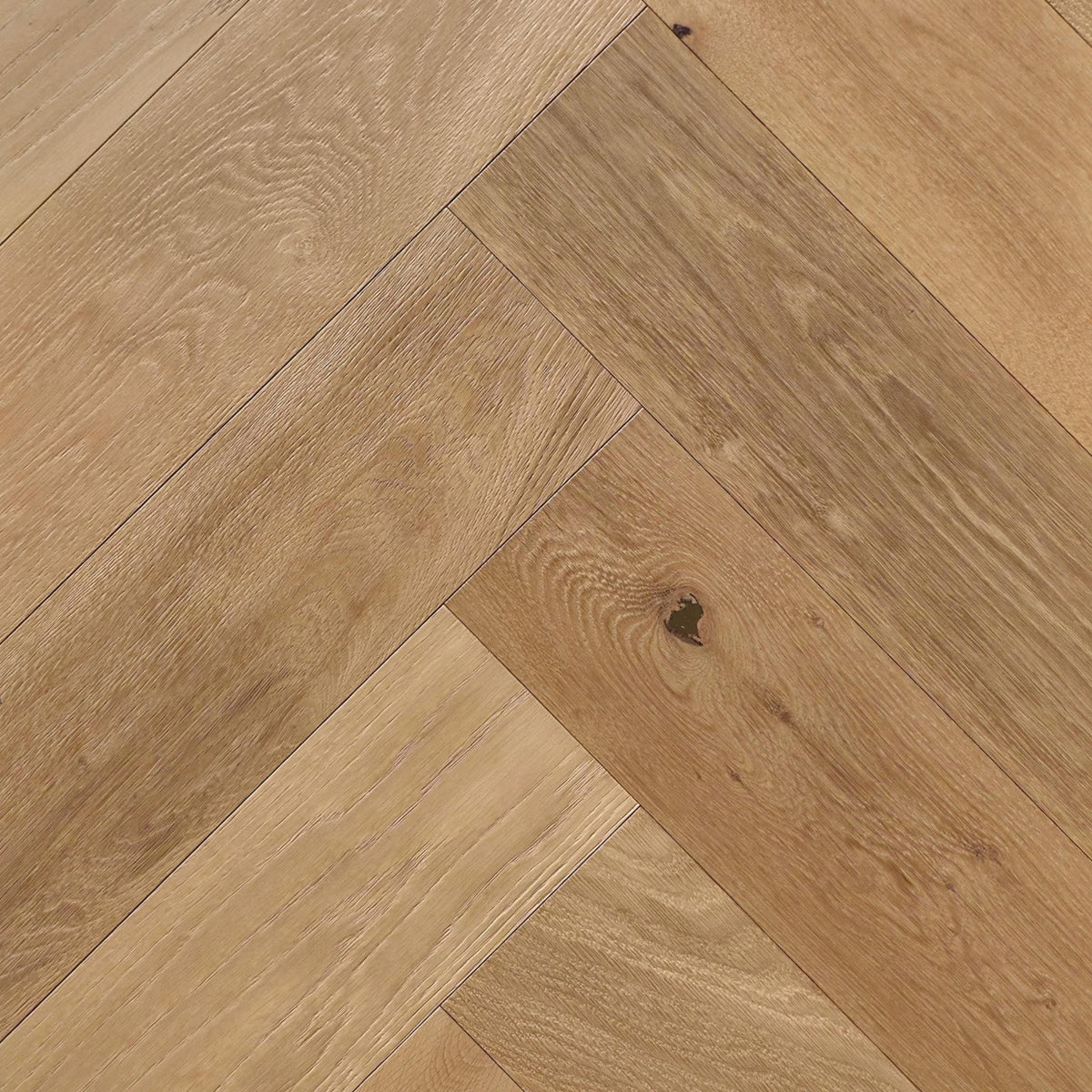Engineered European Oak Gstaad Glow - Herringbone shown mounted in natural lighting.