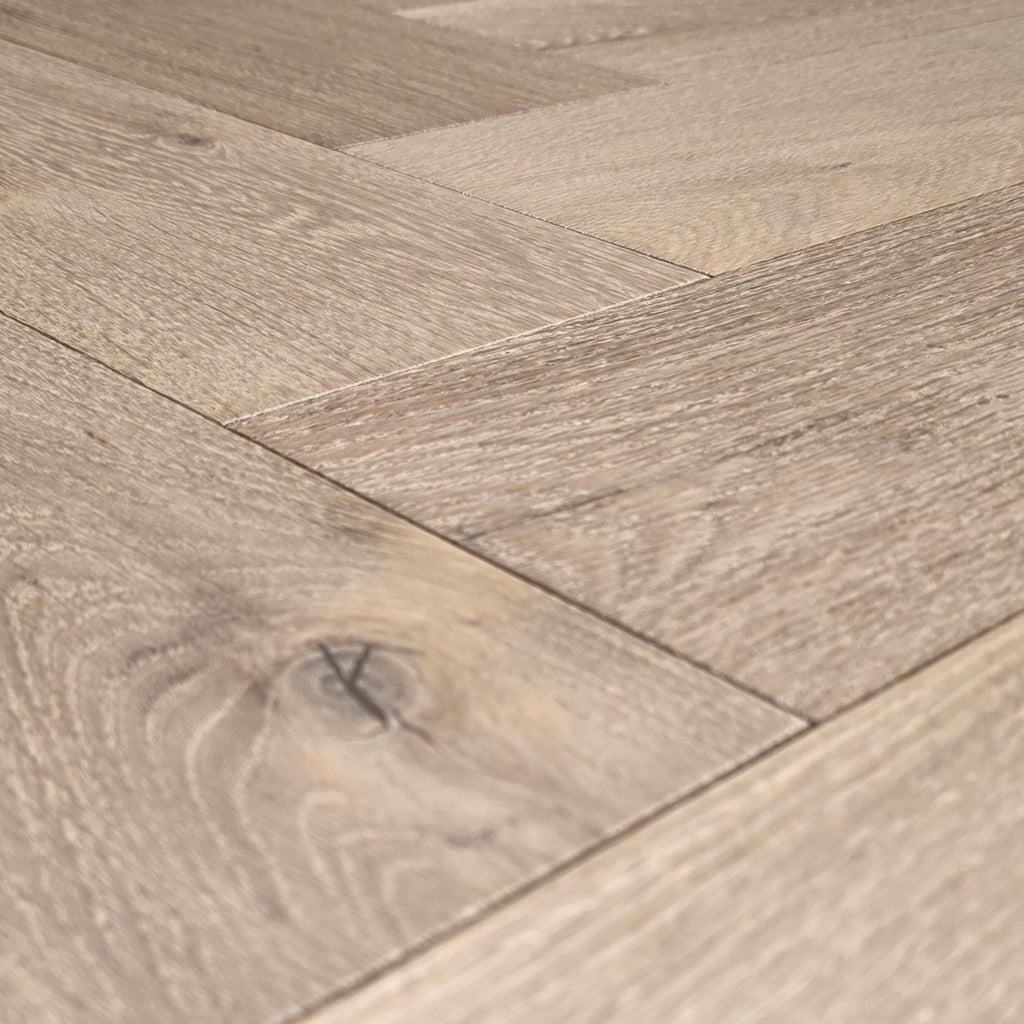 Engineered European White Oak arranged in a herringbone pattern.  Close up.