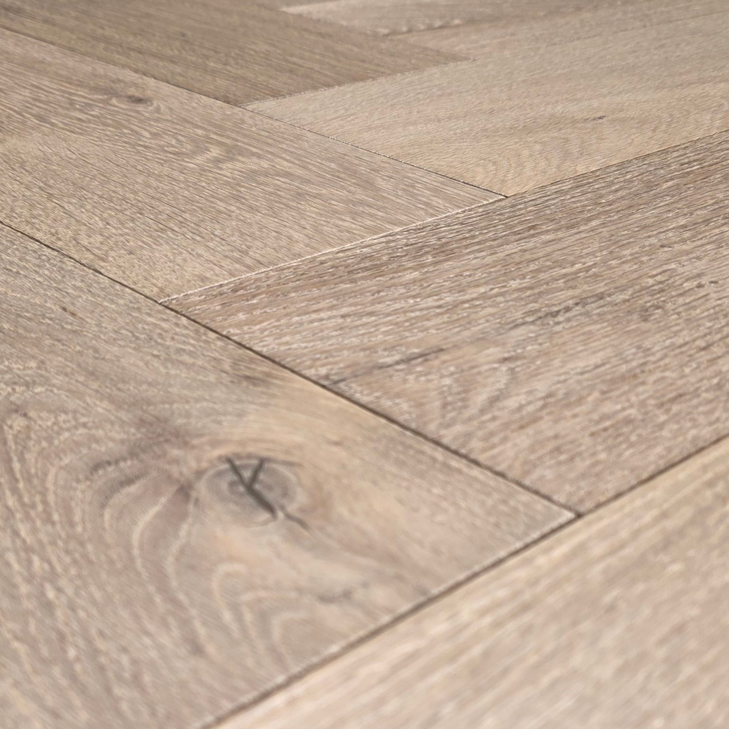 Engineered European White Oak arranged in a herringbone pattern.  Close up.