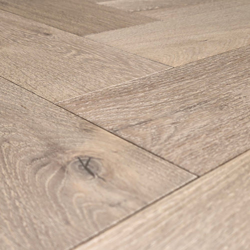 Engineered European White Oak arranged in a herringbone pattern.  Close up.
