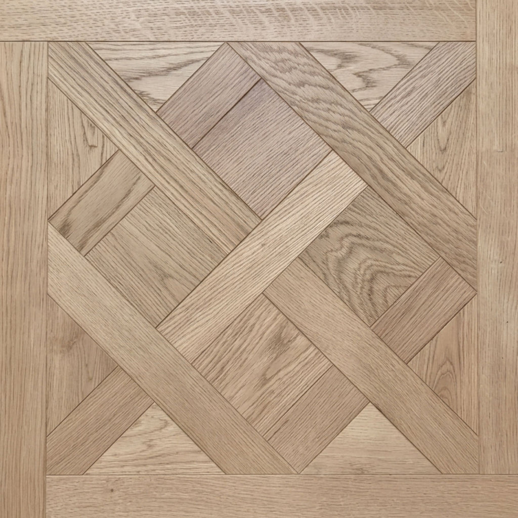 Light stained European white oak wood parquet flooring with a geometric herringbone and diamond pattern, featuring visible wood grain textures.
Engineered European Oak Nouveau Manoir - Parquet is the flooring featured here.