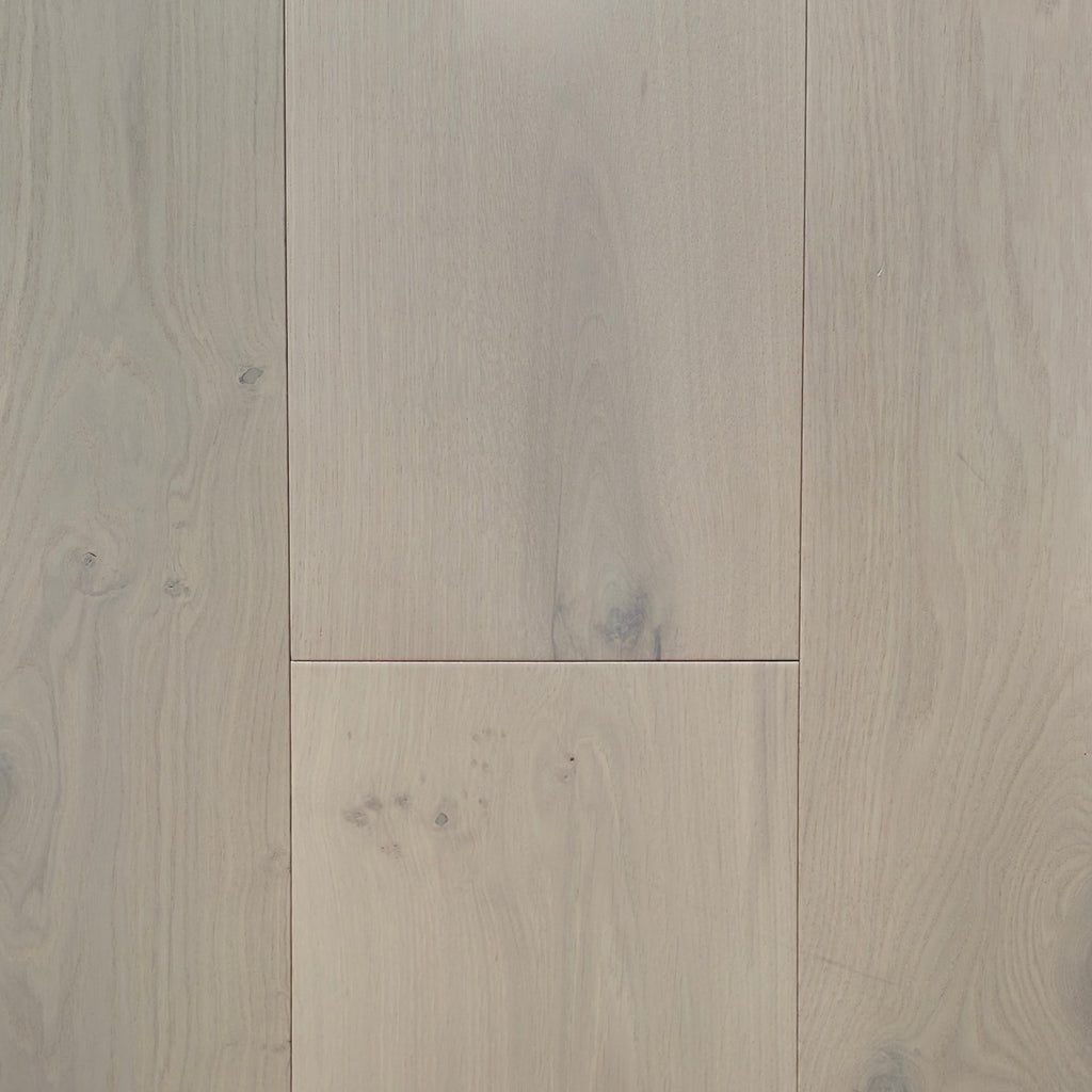 Light beige wood flooring planks with visible natural grain patterns and subtle knots. Engineered European oak Whistler Ascent - Wide Plank is shown.