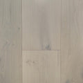 Light beige wood flooring planks with visible natural grain patterns and subtle knots. Engineered European oak Whistler Ascent - Wide Plank is shown.