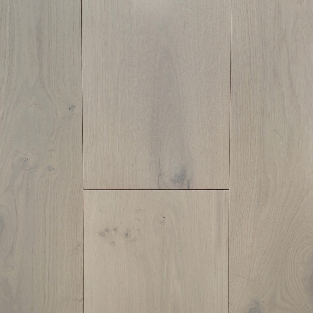Light beige wood flooring planks with visible natural grain patterns and subtle knots. Engineered European oak Whistler Ascent - Wide Plank is shown.