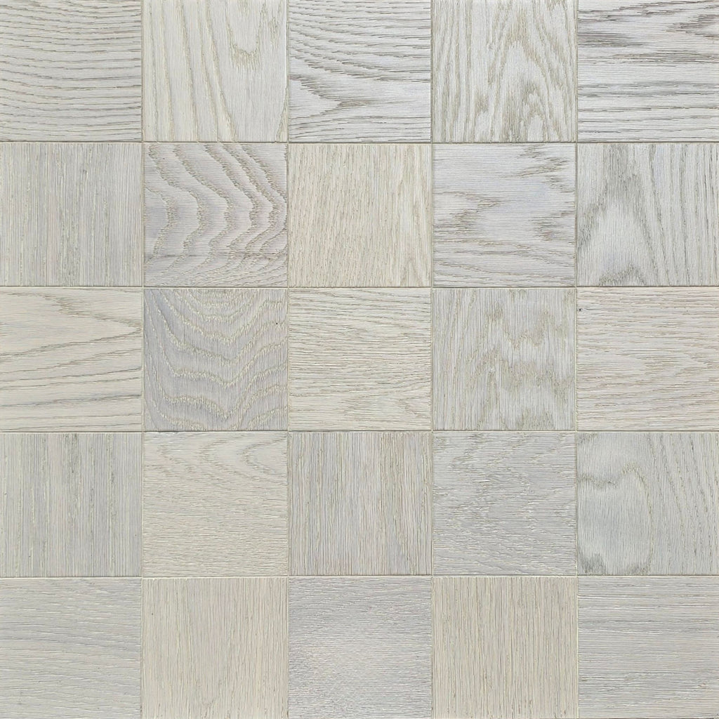 Light gray and off-white wood-look square tiles arranged in a grid pattern, showing varied grain textures. Engineered European Oak Loire Mist Parquet flooring.