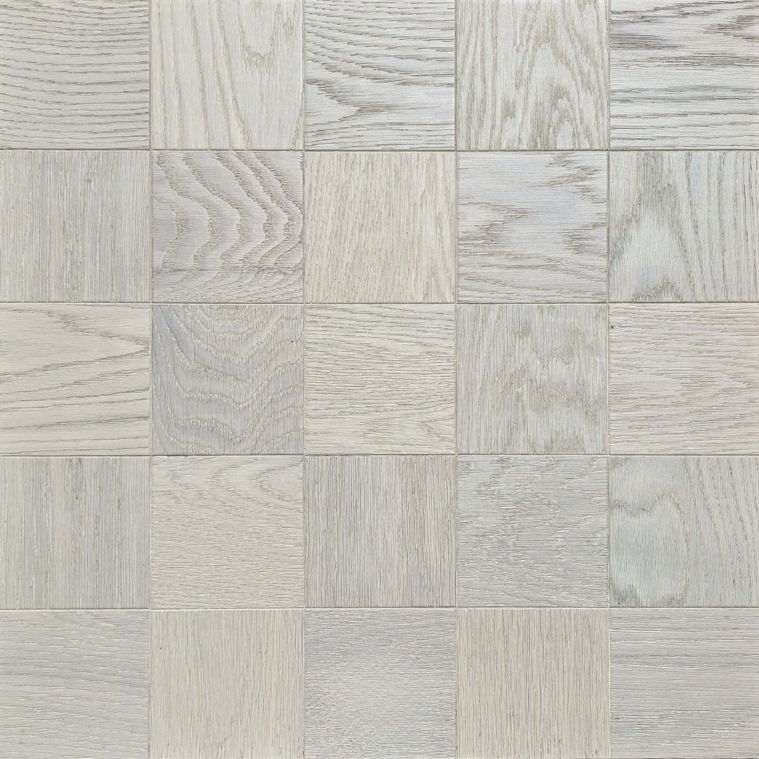 Light gray and off-white wood-look square tiles arranged in a grid pattern, showing varied grain textures. Engineered European Oak Loire Mist Parquet flooring.
