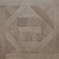 Geometric parquet wood flooring sample with concentric diamond and square patterns in varying light oak tones. Engineered European oak ember valley parquet tile shown. 