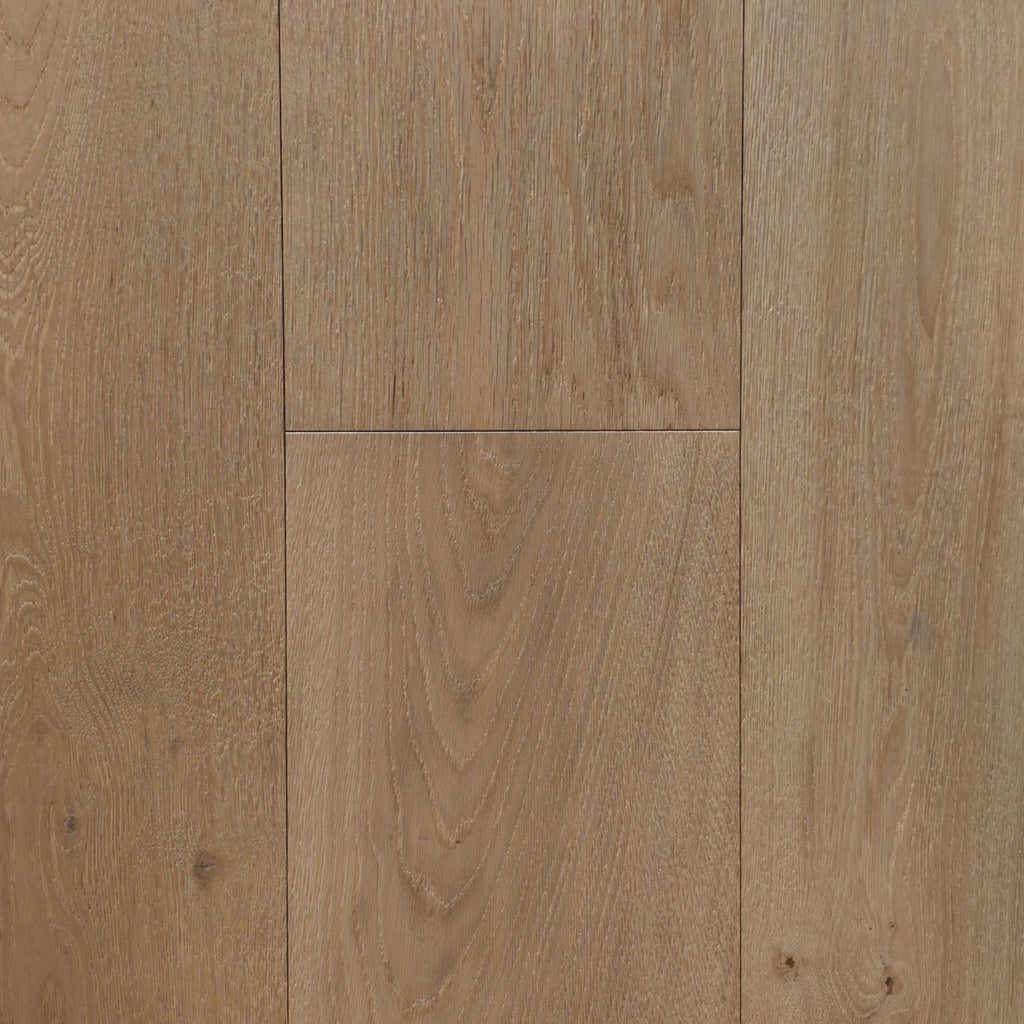Light oak wood flooring planks with visible natural grain patterns and warm tan-brown tones. Engineered European oak hearthside Oak wide plank is the product shown.