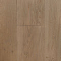 Light oak wood flooring planks with visible natural grain patterns and warm tan-brown tones. Engineered European oak hearthside Oak wide plank is the product shown.